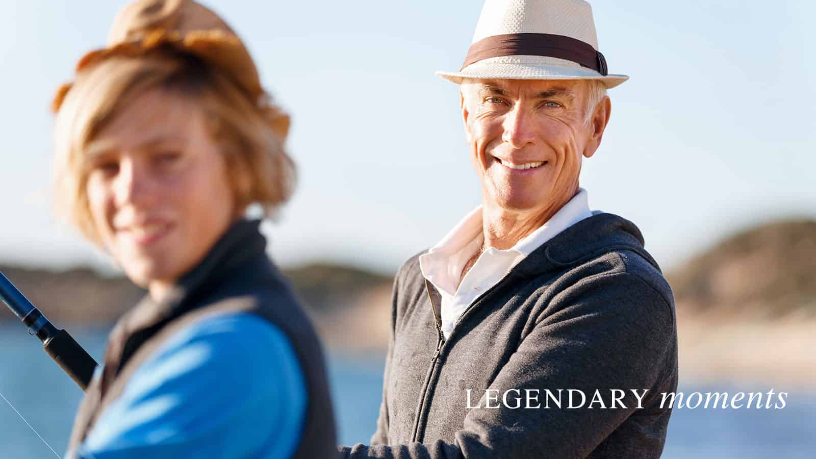 Senior couple standing on a dock facing camera